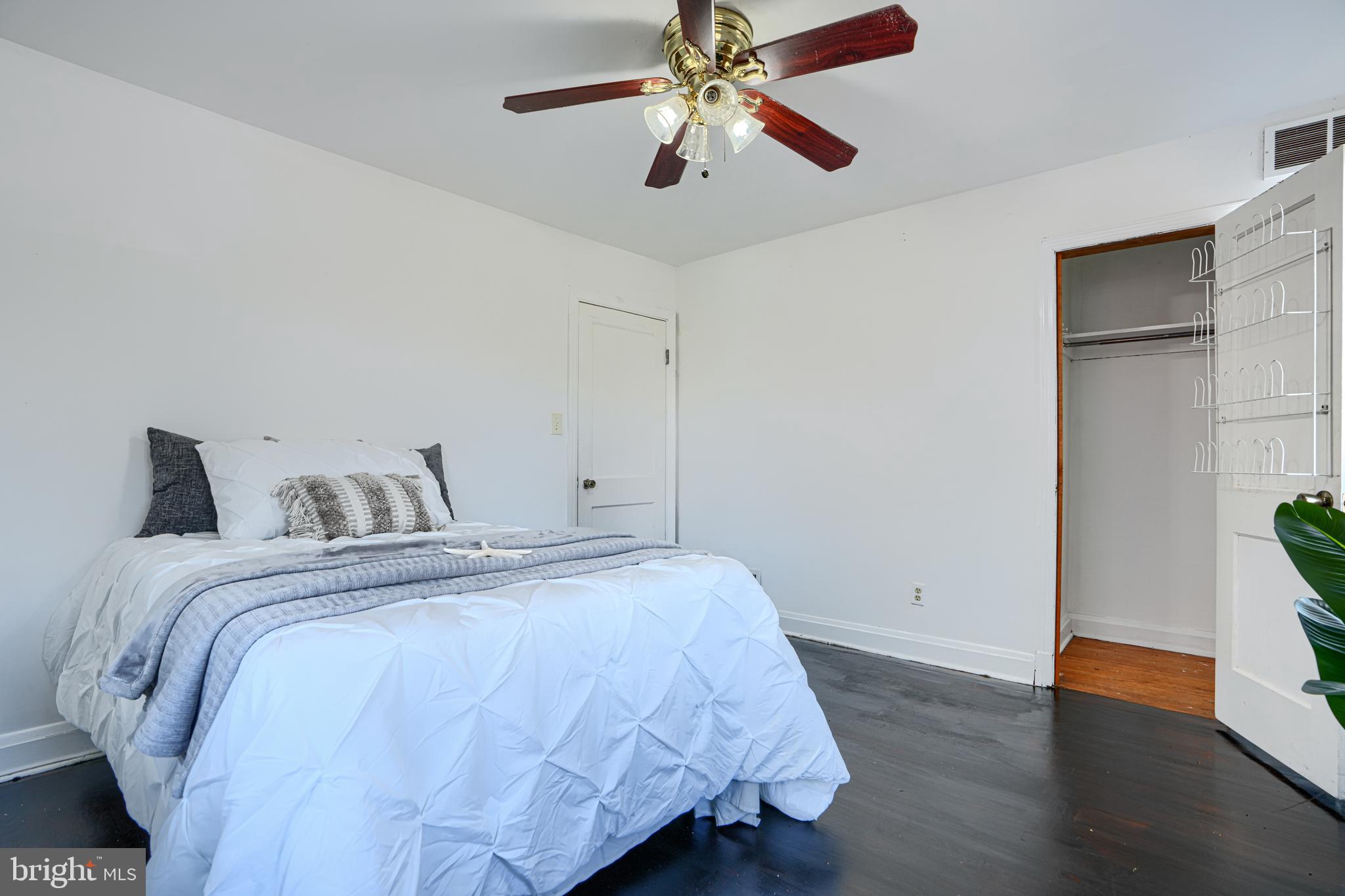 755 South Woodington Road Baltimore, MD 21229 - Photo 22 of 40 a bedroom with bed and wooden floor