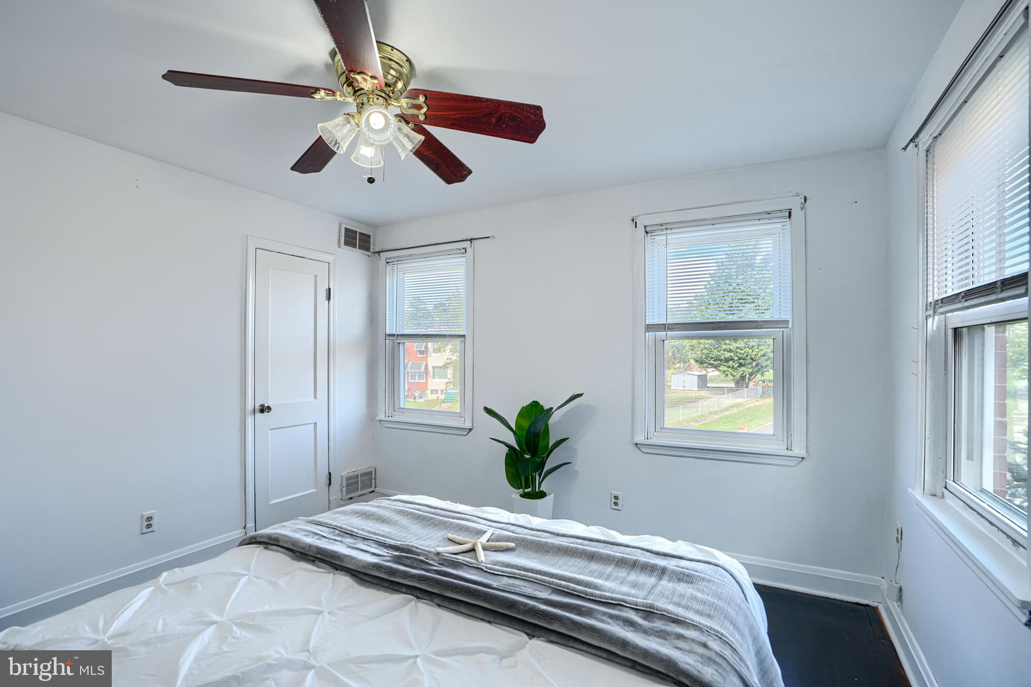 755 South Woodington Road Baltimore, MD 21229 - Photo 23 of 40 a bedroom with a large bed and a window