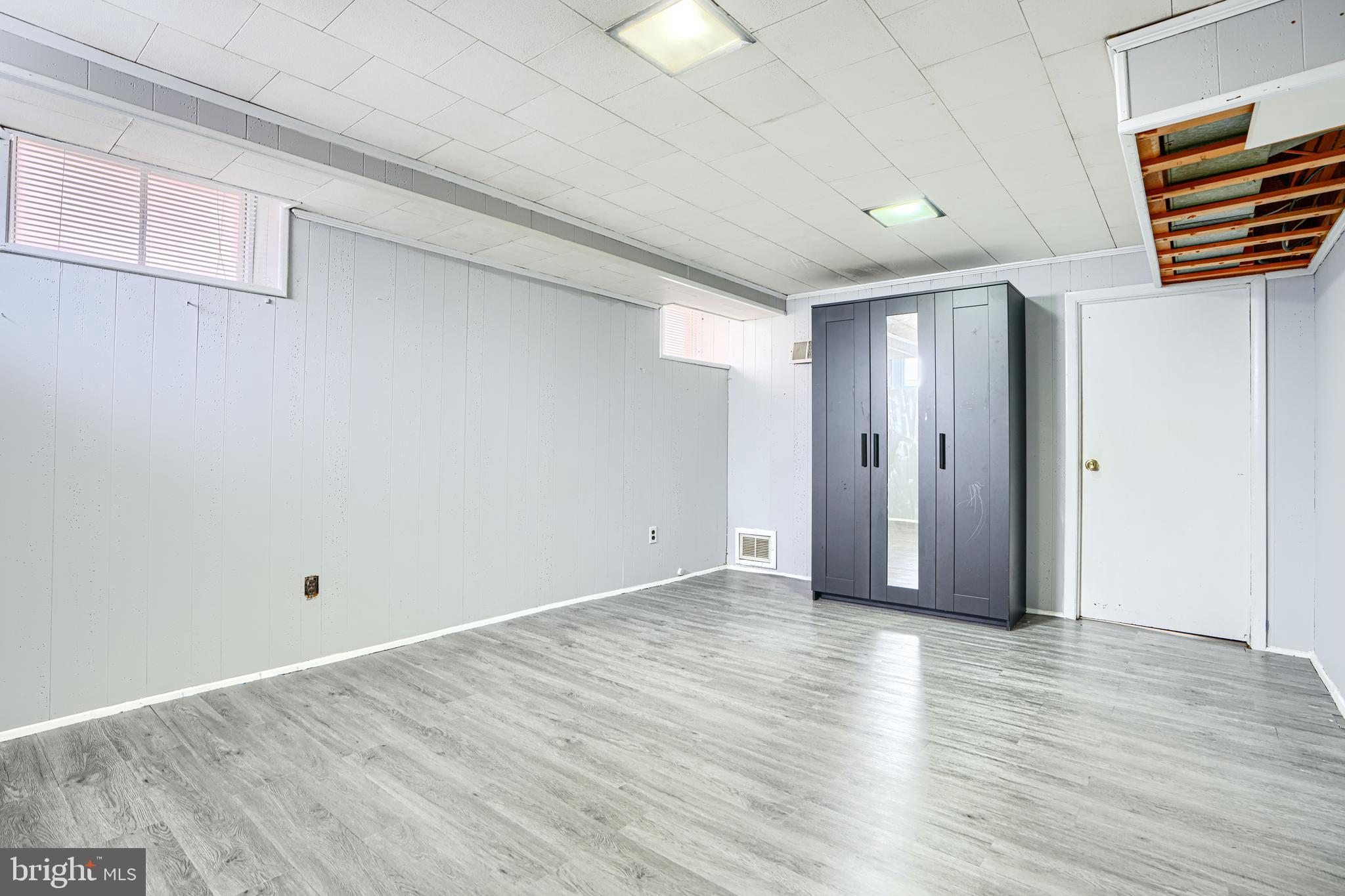 755 South Woodington Road Baltimore, MD 21229 - Photo 30 of 40 wooden floor in an empty room with wooden floor