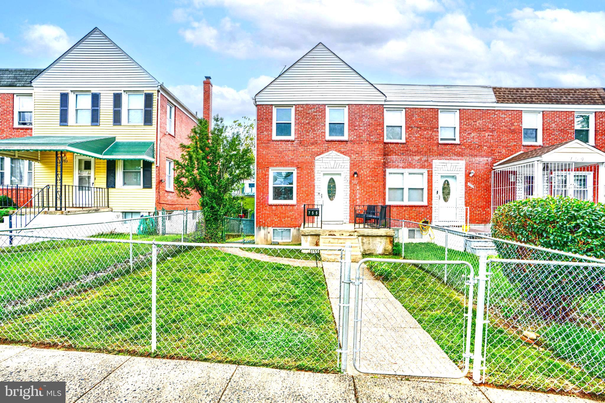755 South Woodington Road Baltimore, MD 21229 - Photo 3 of 40 a front view of a house with a yard