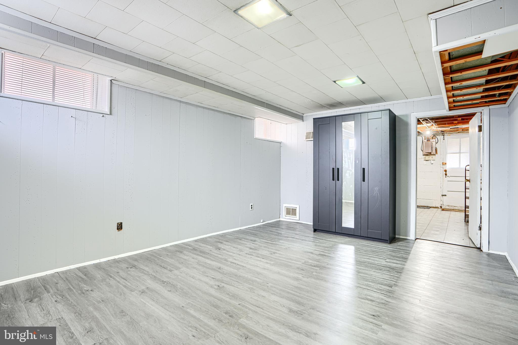 755 South Woodington Road Baltimore, MD 21229 - Photo 31 of 40 wooden floor in an empty room with a window