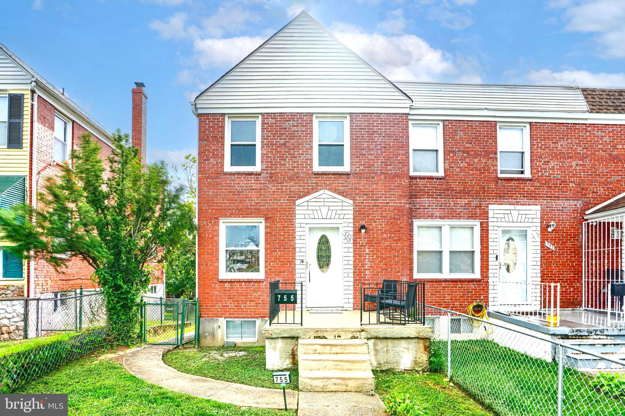 755 South Woodington Road Baltimore, MD 21229 - Photo 39 of 40 a front view of a house with a yard