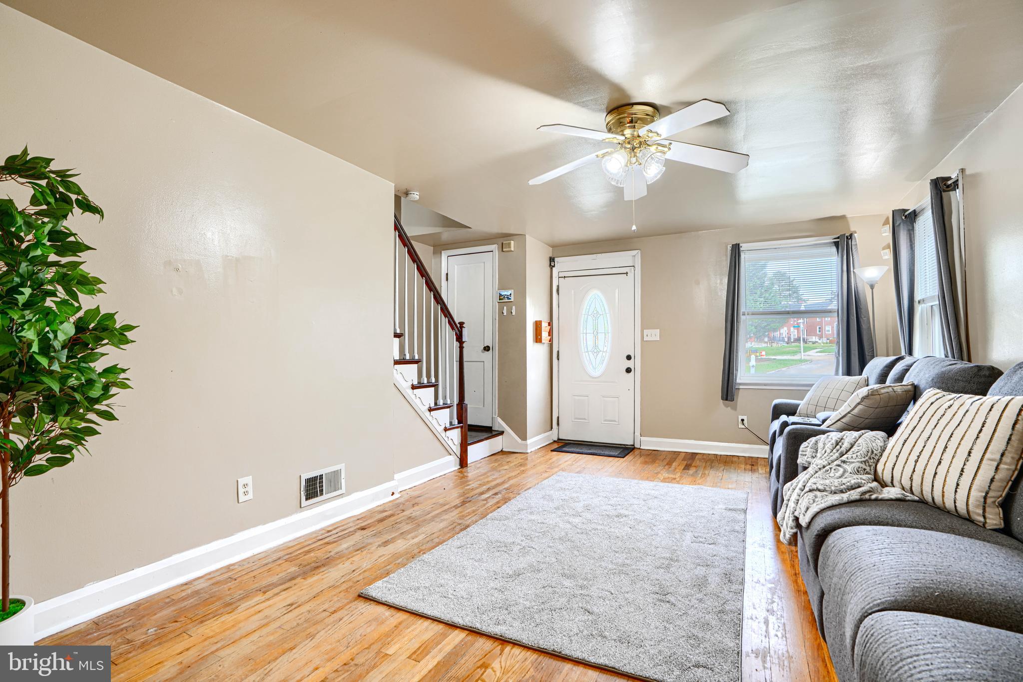 755 South Woodington Road Baltimore, MD 21229 - Photo 5 of 40 a living room with furniture and a chandelier