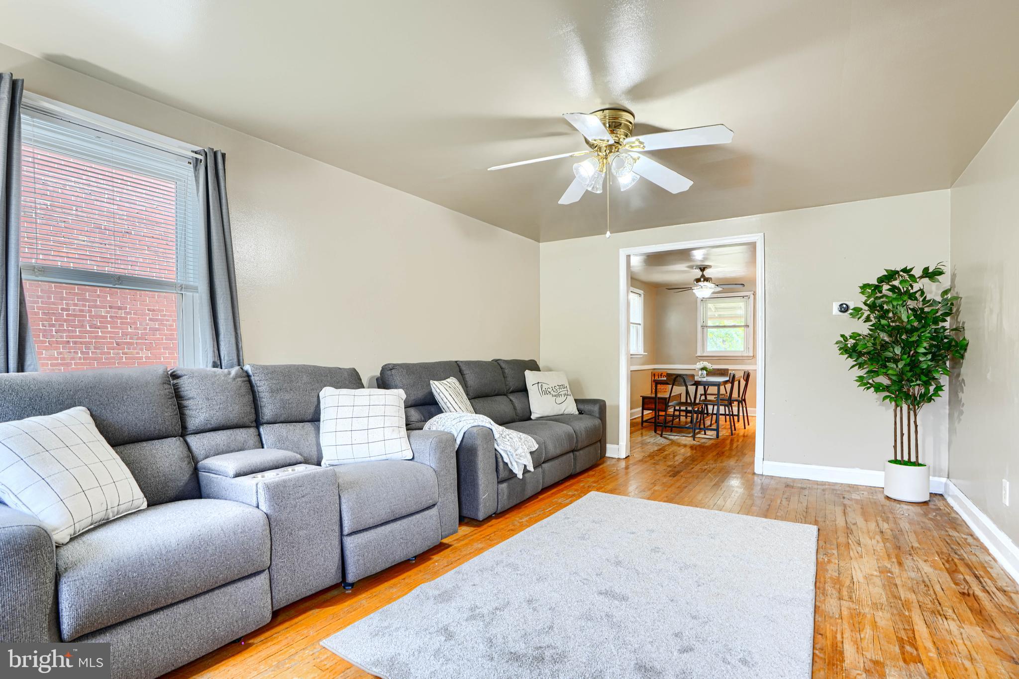 755 South Woodington Road Baltimore, MD 21229 - Photo 6 of 40 a living room with furniture and a potted plant