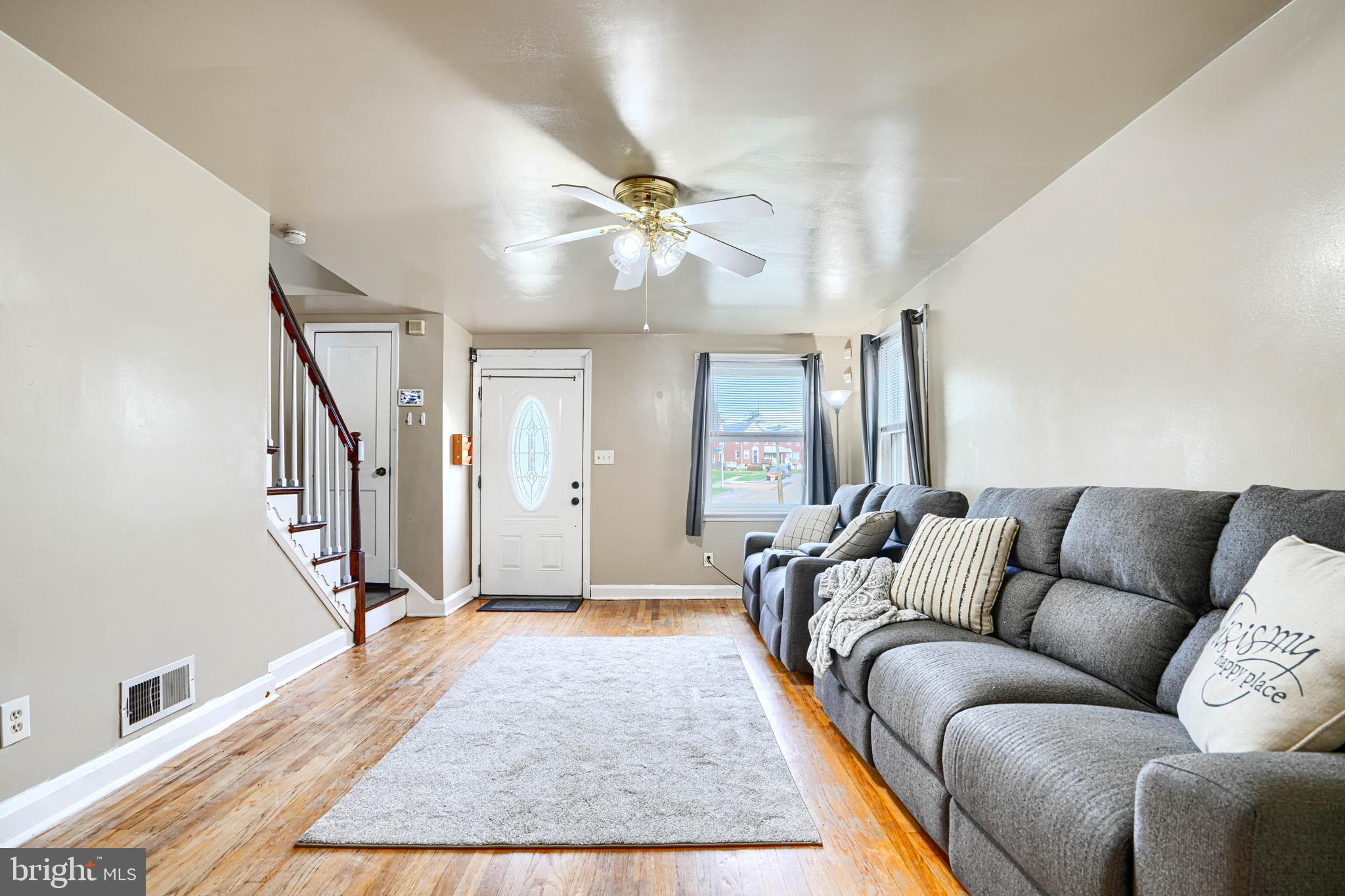 755 South Woodington Road Baltimore, MD 21229 - Photo 7 of 40 a living room with furniture and a ceiling fan