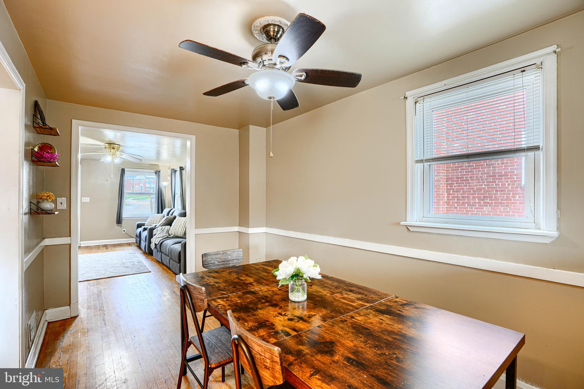 755 South Woodington Road Baltimore, MD 21229 - Photo 8 of 40 a view of a dining room with furniture and wooden floor