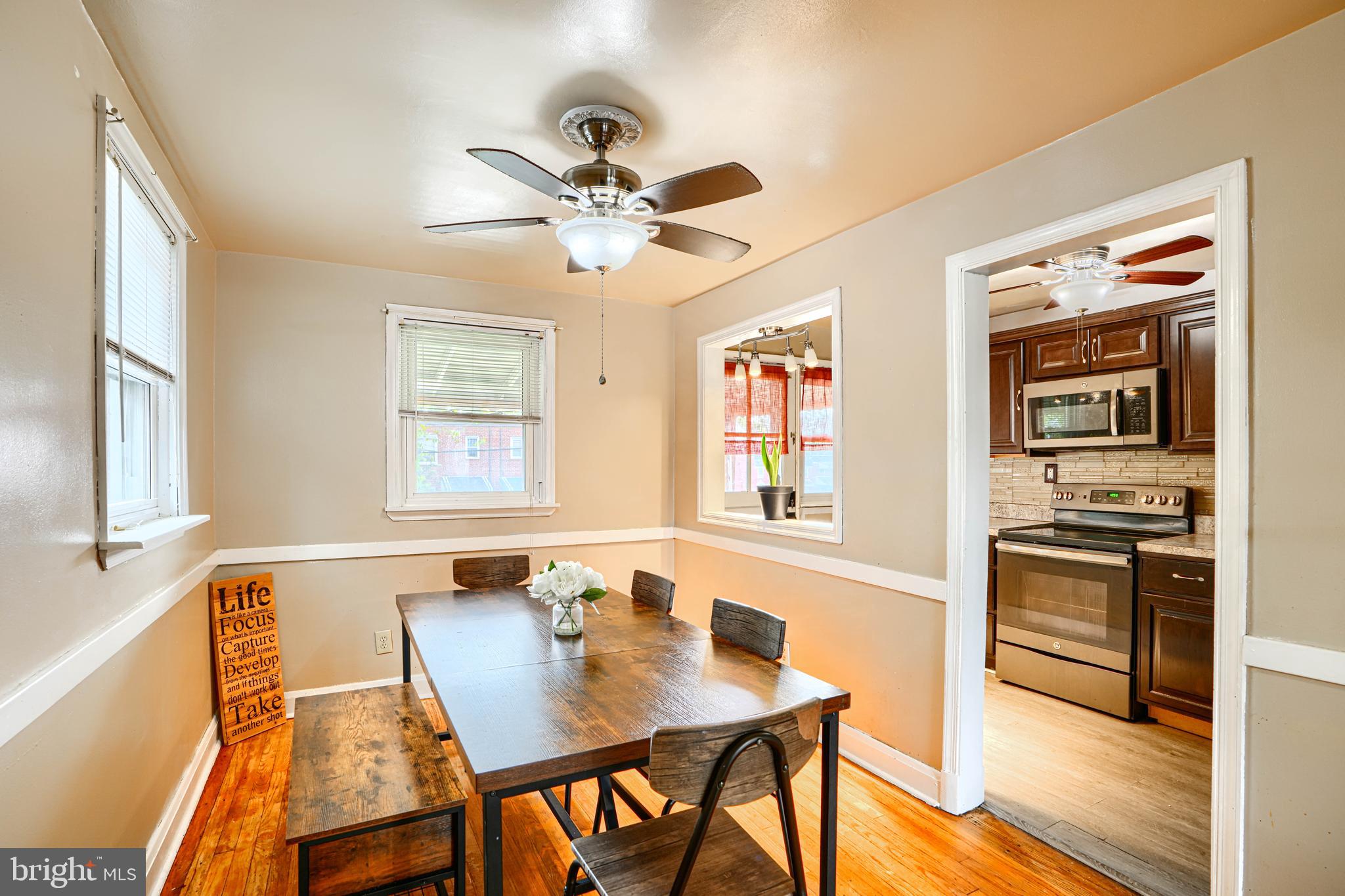 755 South Woodington Road Baltimore, MD 21229 - Photo 10 of 40 a view of a dining room with furniture window and wooden floor