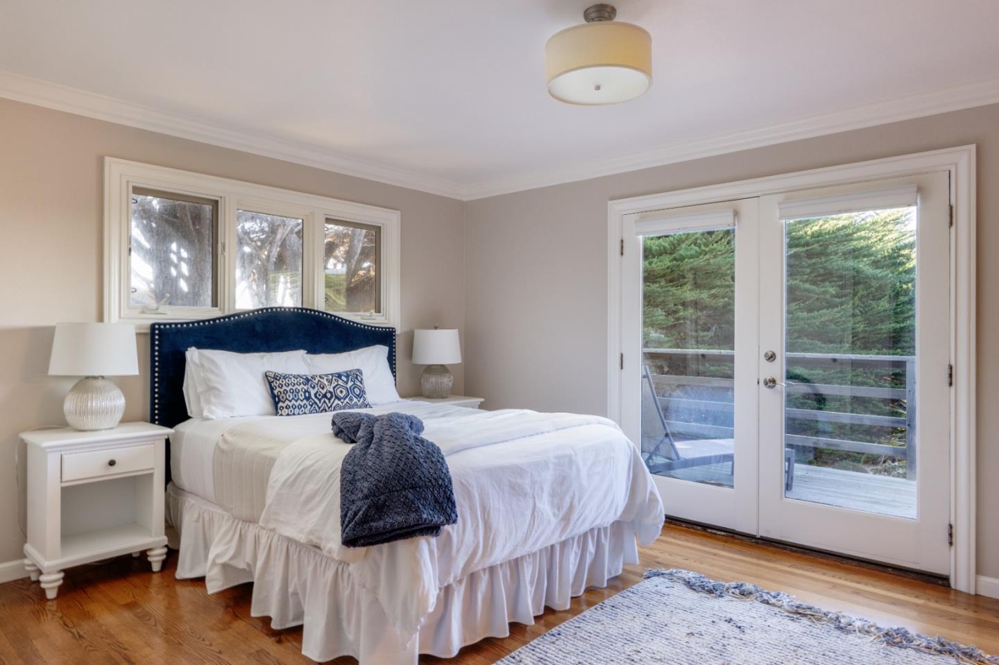 142 Carmel Riviera Drive Carmel, CA 93923 - Photo 12 of 23 a bedroom with a bed and a window