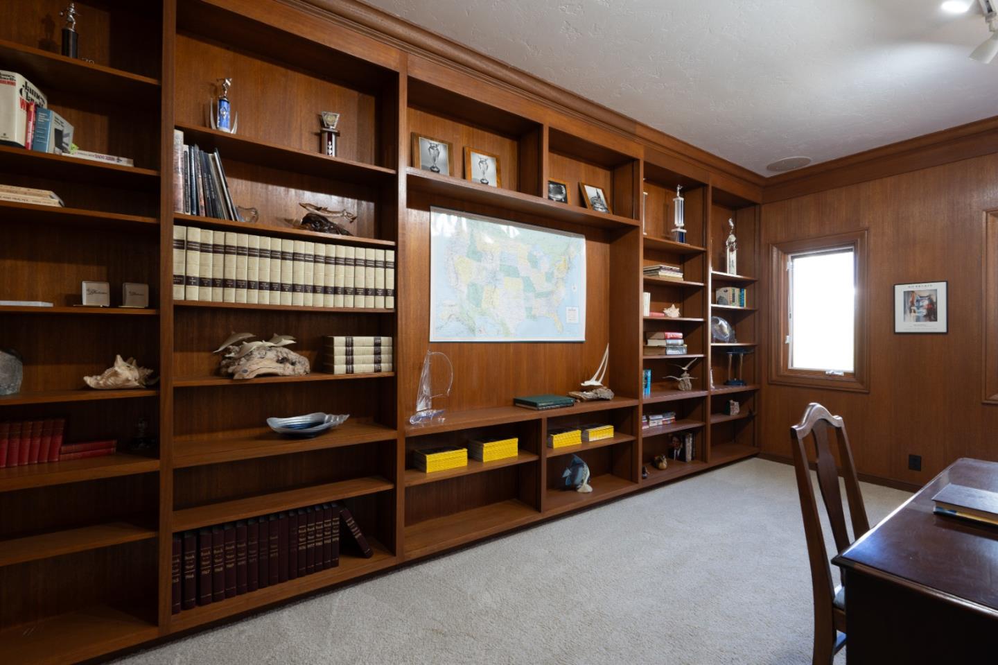 142 Carmel Riviera Drive Carmel, CA 93923 - Photo 17 of 23 a room with furniture closet and book shelf