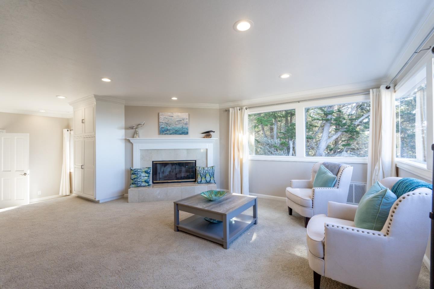 142 Carmel Riviera Drive Carmel, CA 93923 - Photo 19 of 23 a living room with furniture and a fireplace