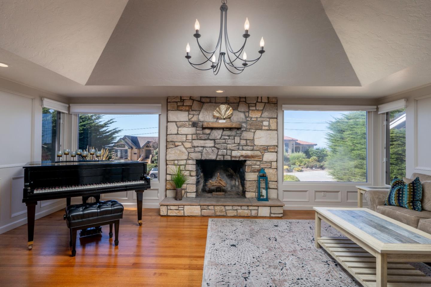 142 Carmel Riviera Drive Carmel, CA 93923 - Photo 2 of 23 a living room with furniture a fireplace a lamp and a large window