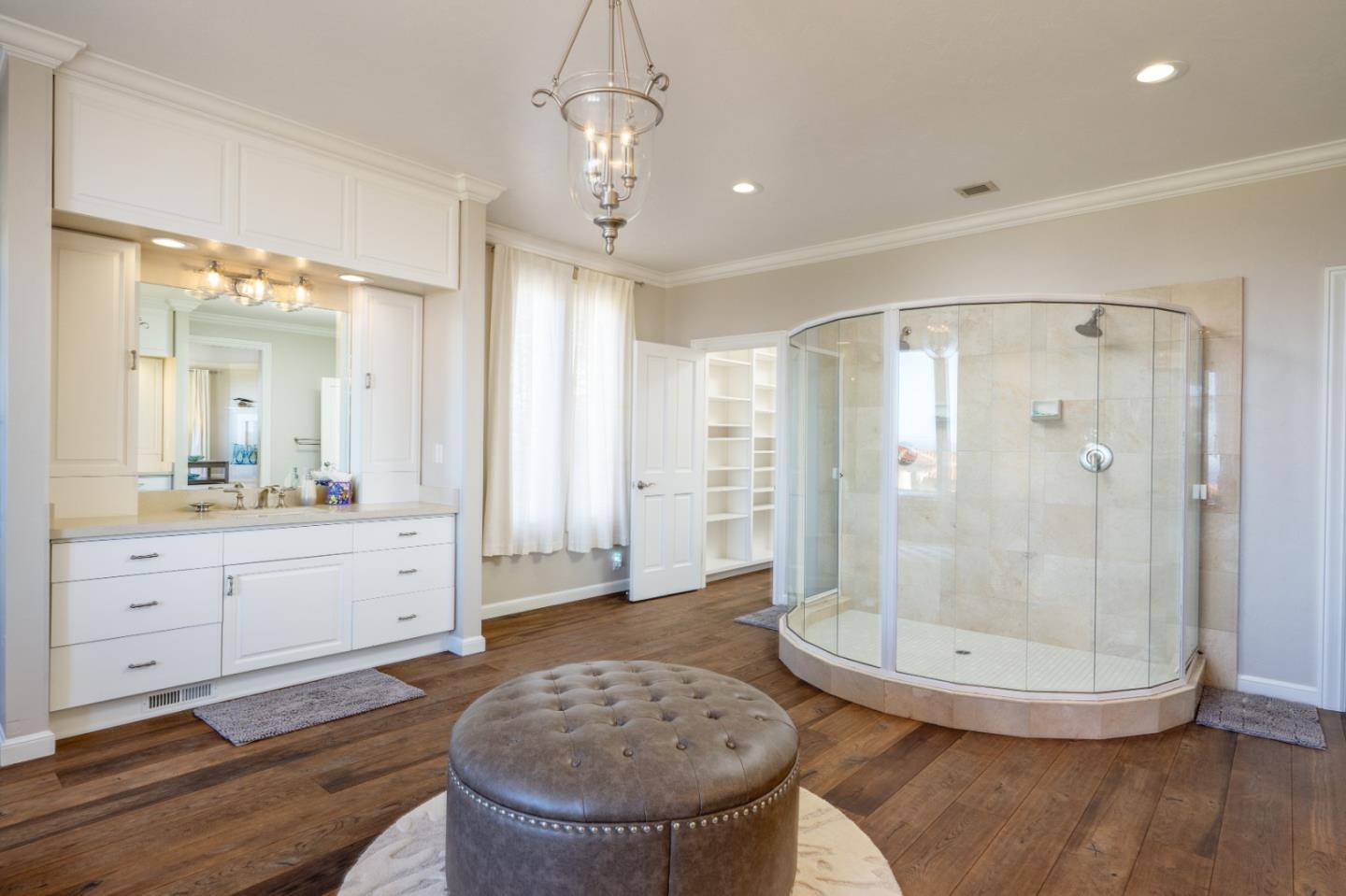 142 Carmel Riviera Drive Carmel, CA 93923 - Photo 23 of 23 a bathroom with a sink a toilet a mirror and shower