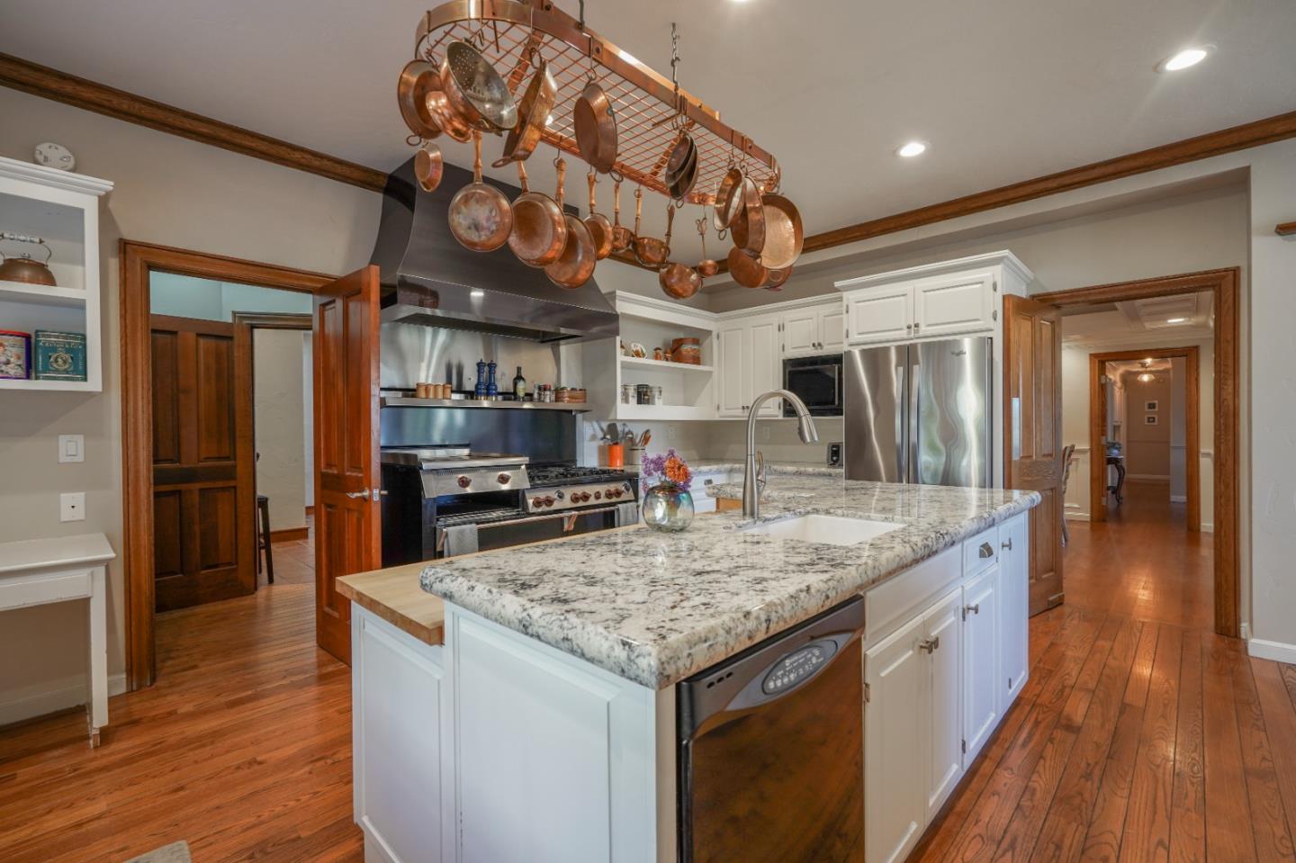 142 Carmel Riviera Drive Carmel, CA 93923 - Photo 8 of 23 a kitchen with a counter space wooden floor and stainless steel appliances