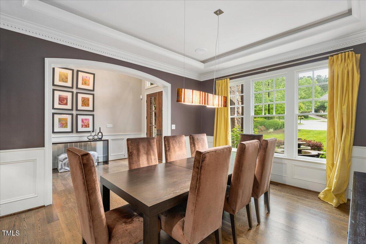 3601 Nightfall Court Raleigh, NC 27607 - Photo 12 of 88 a view of a dining room with furniture window and wooden floor