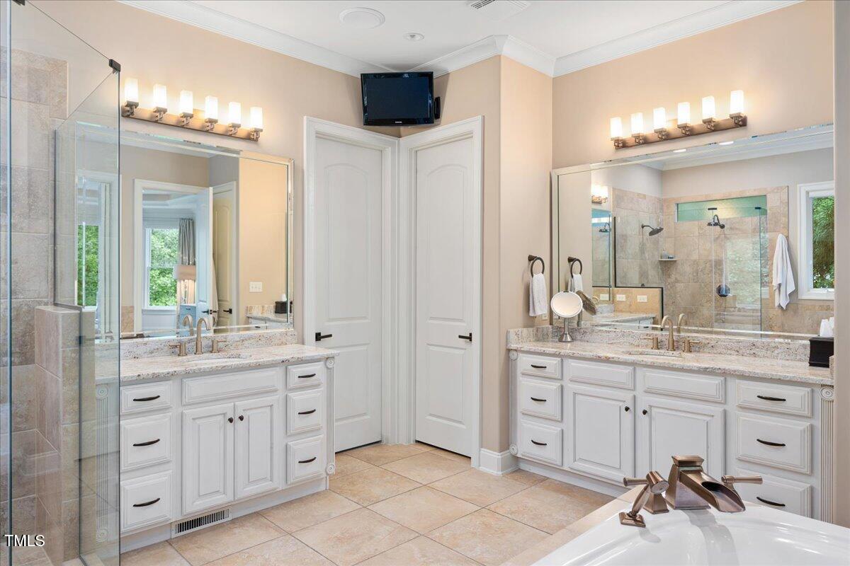 3601 Nightfall Court Raleigh, NC 27607 - Photo 23 of 88 a spacious bathroom with a granite countertop sink a mirror and a