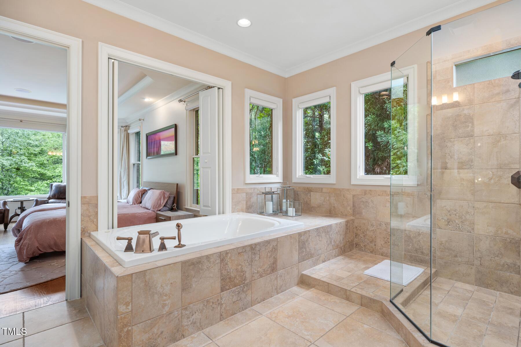 3601 Nightfall Court Raleigh, NC 27607 - Photo 25 of 88 a bathroom with a tub sink and mirror