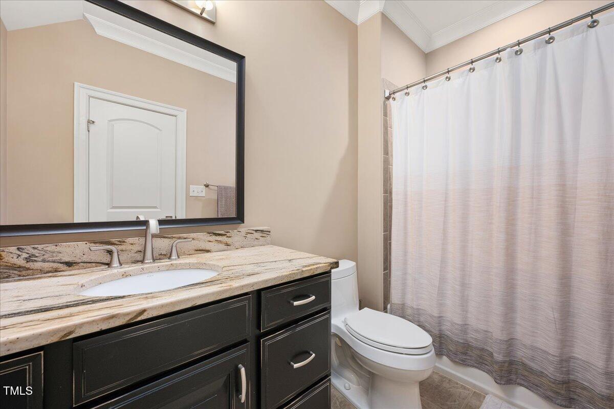 3601 Nightfall Court Raleigh, NC 27607 - Photo 29 of 88 a bathroom with a granite countertop sink toilet and a mirror