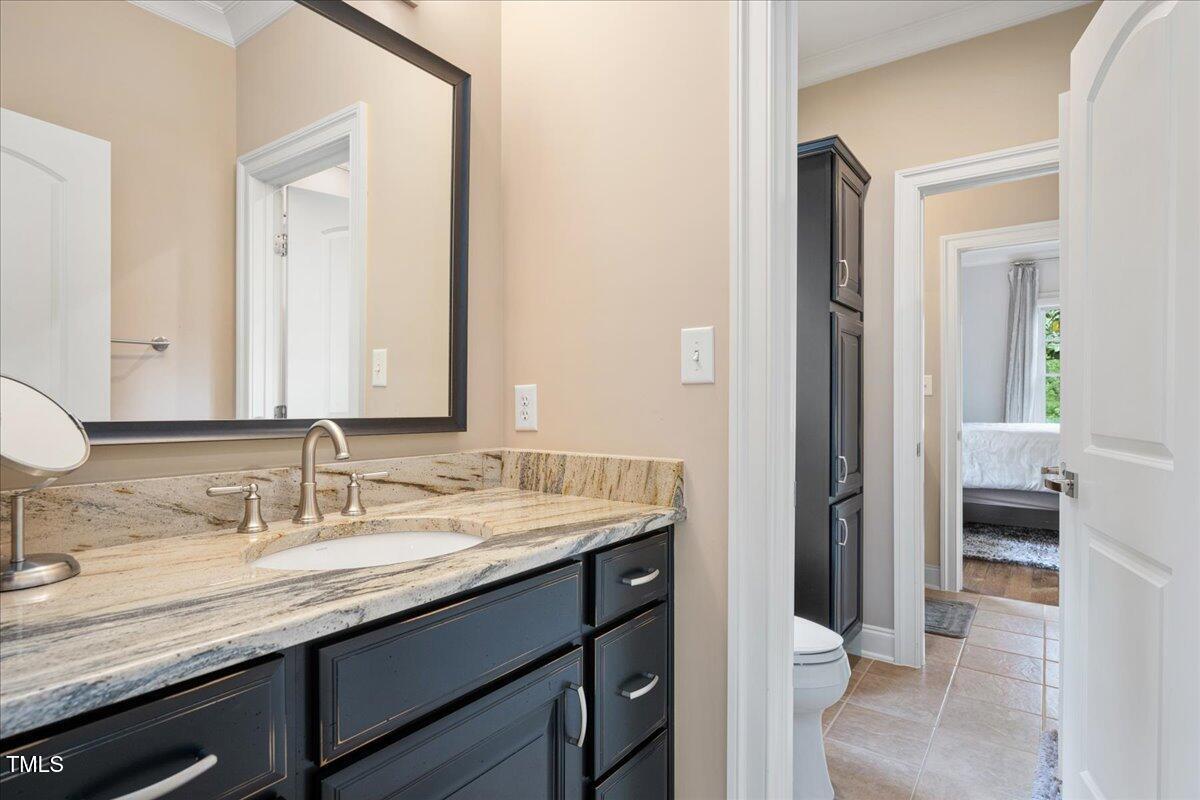 3601 Nightfall Court Raleigh, NC 27607 - Photo 32 of 88 a bathroom with a sink and a mirror