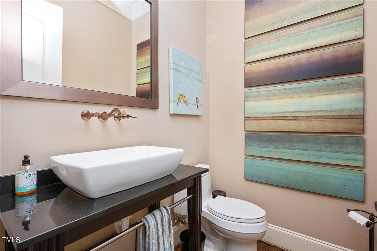 3601 Nightfall Court Raleigh, NC 27607 - Photo 34 of 88 a bathroom with a sink and a toilet