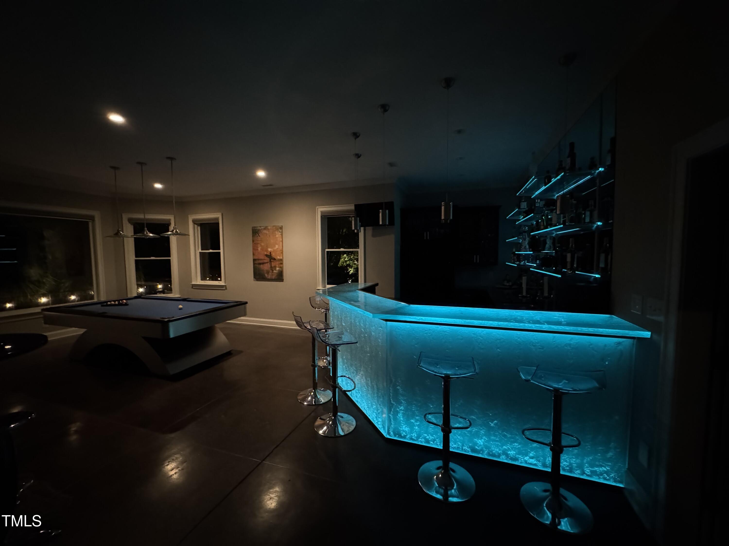 3601 Nightfall Court Raleigh, NC 27607 - Photo 40 of 88 a living room with furniture a rug and a projector