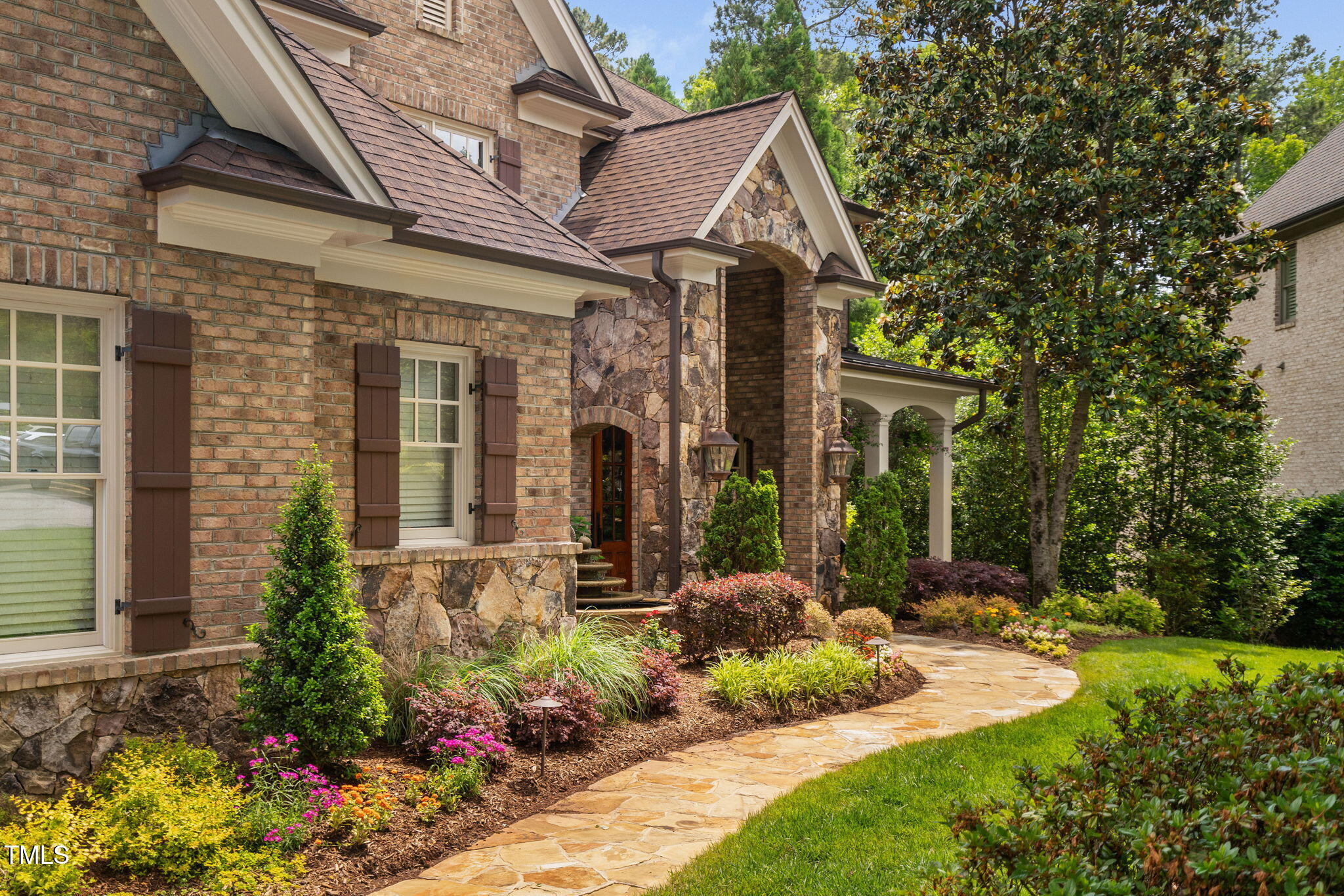 3601 Nightfall Court Raleigh, NC 27607 - Photo 4 of 88 a front view of a house with a yard and outdoor seating