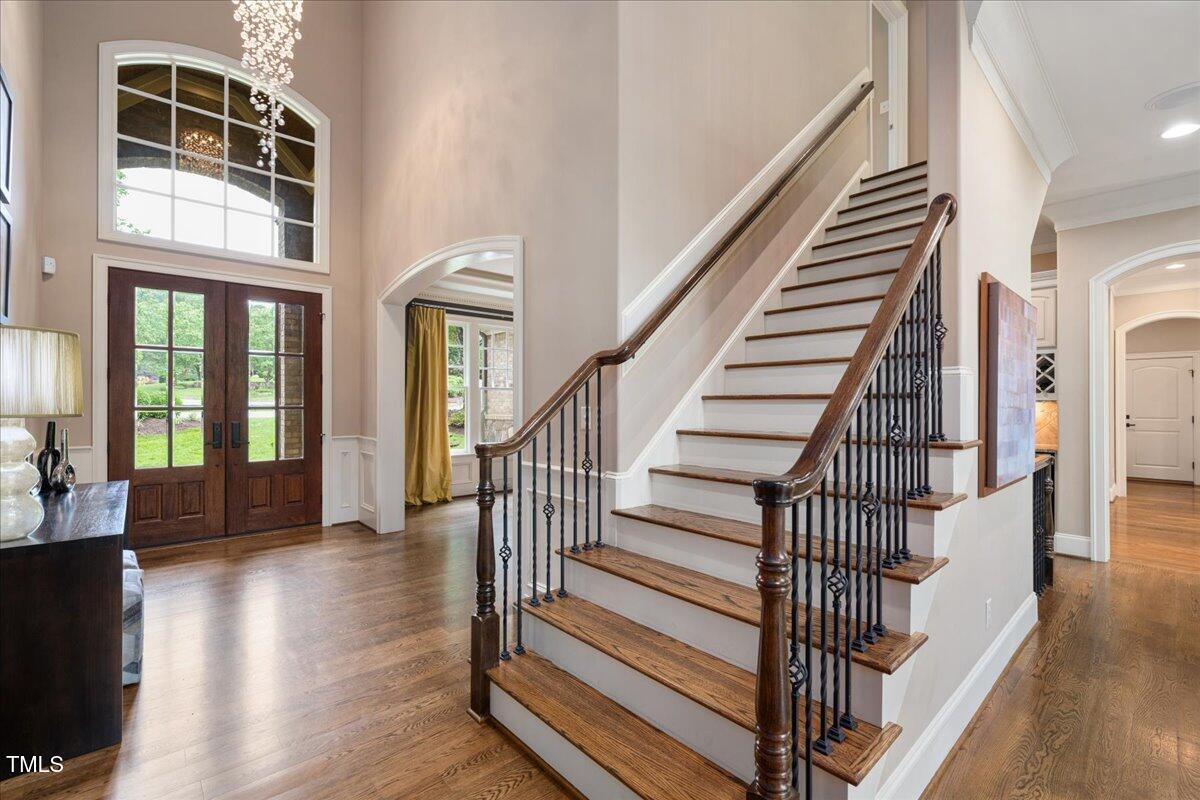 3601 Nightfall Court Raleigh, NC 27607 - Photo 6 of 88 a view of staircase with white walls and wooden floor
