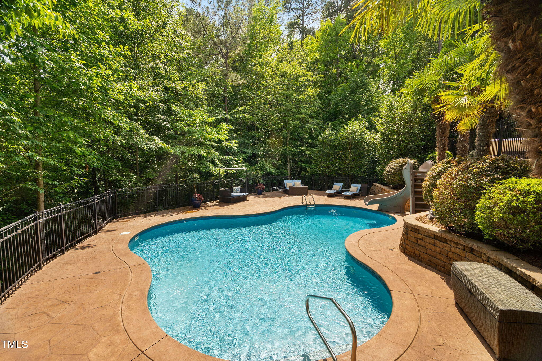 3601 Nightfall Court Raleigh, NC 27607 - Photo 71 of 88 a view of a swimming pool with some potted plants