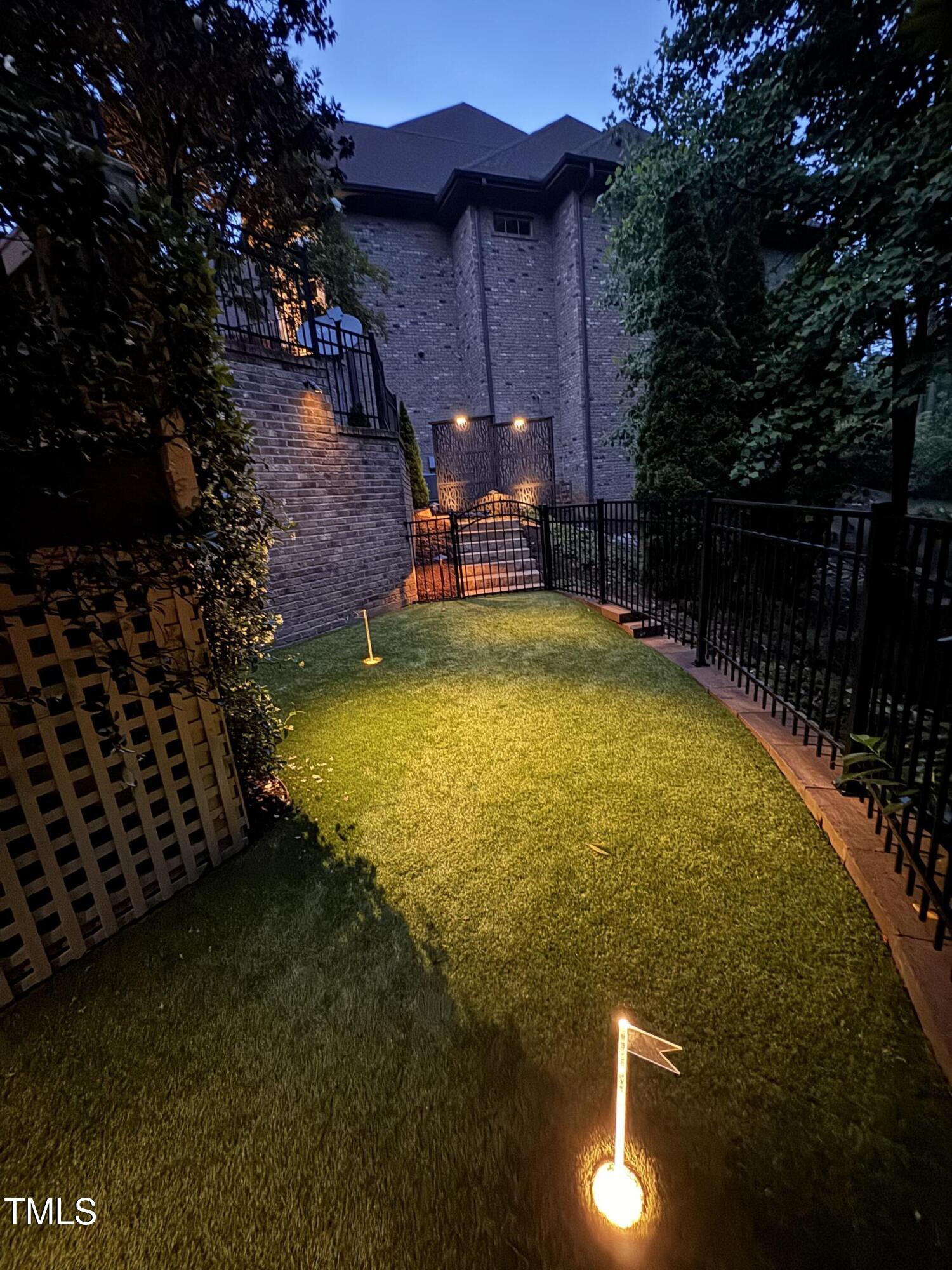 3601 Nightfall Court Raleigh, NC 27607 - Photo 81 of 88 a view of a swimming pool with lawn chairs under an umbrella
