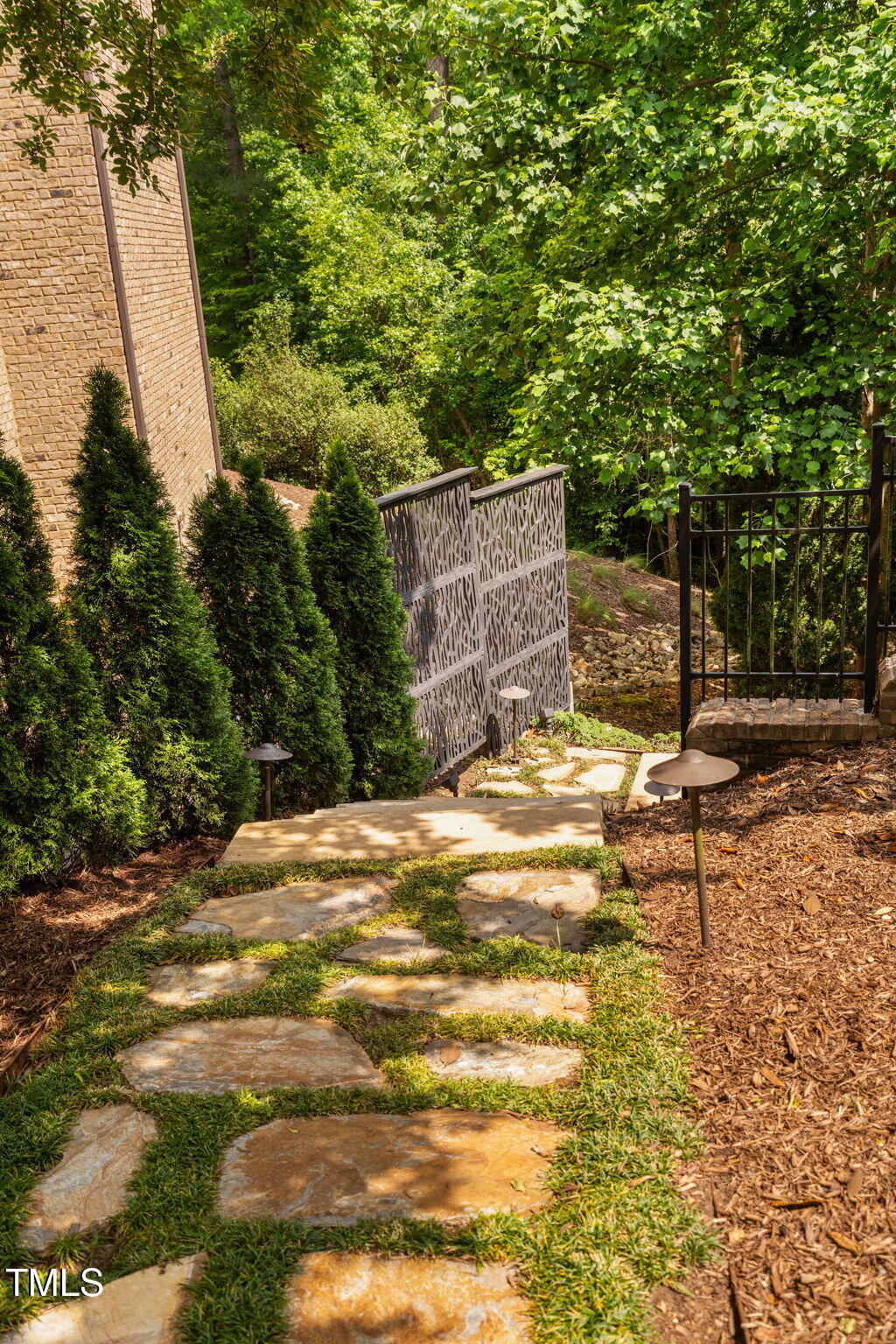 3601 Nightfall Court Raleigh, NC 27607 - Photo 83 of 88 a backyard of a house with large trees