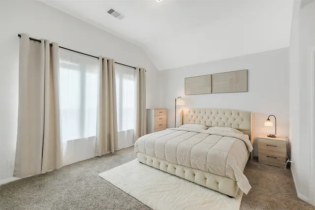 a bathroom with a sink mirror and a shower