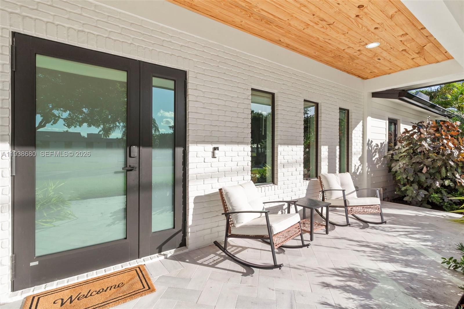 3540 Northeast 28th Avenue Lighthouse Point, FL 33064 - Photo 40 of 47 a building outdoor space with patio furniture and potted plants