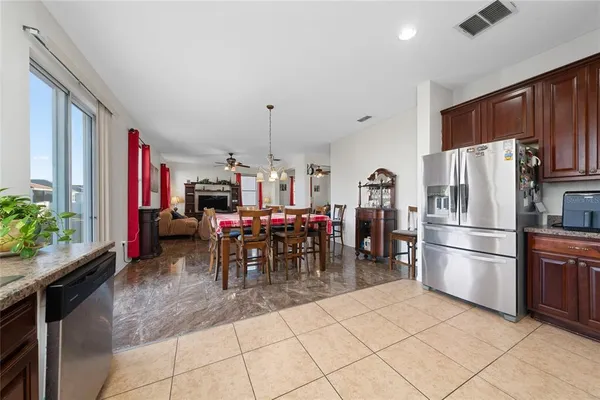 a kitchen with stainless steel appliances granite countertop a stove cabinets and sink