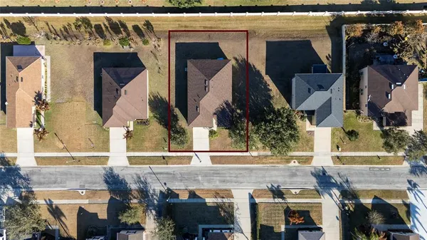 an aerial view of city and lake