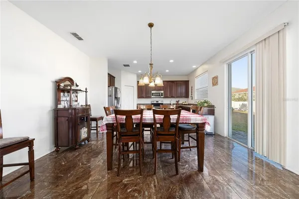 a view of a kitchen and dining room