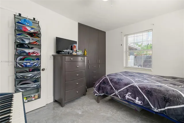 a bedroom with a bed and a closet