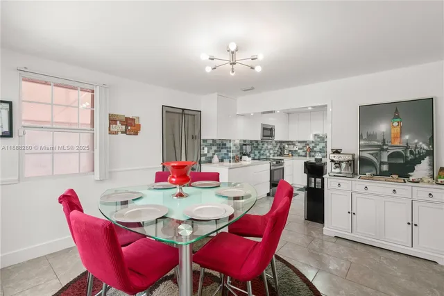 a view of a dining room with furniture and window
