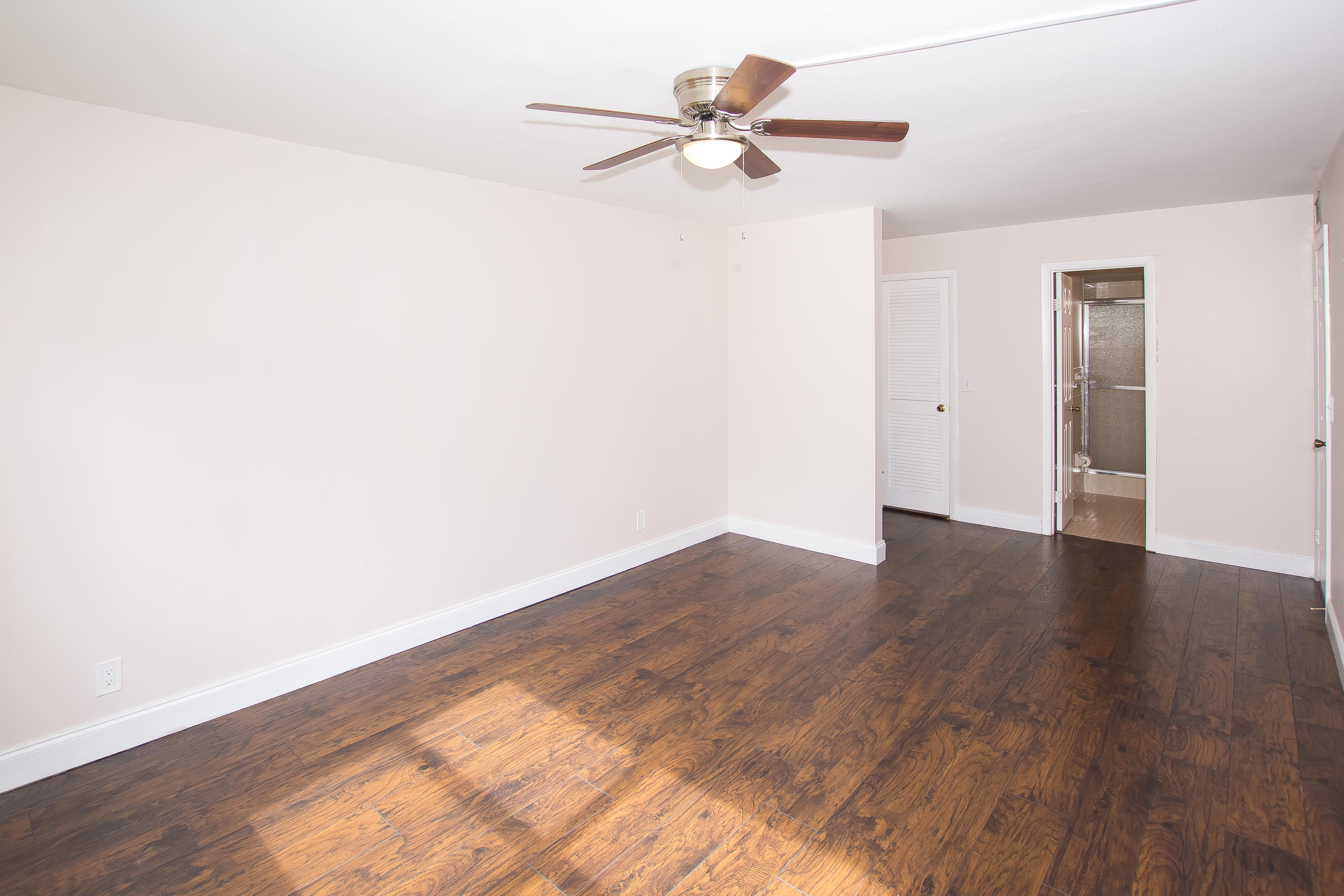 7080 Nova Drive, Unit 306B Davie, FL 33317 - Photo 12 of 25 a view of an empty room with wooden floor
