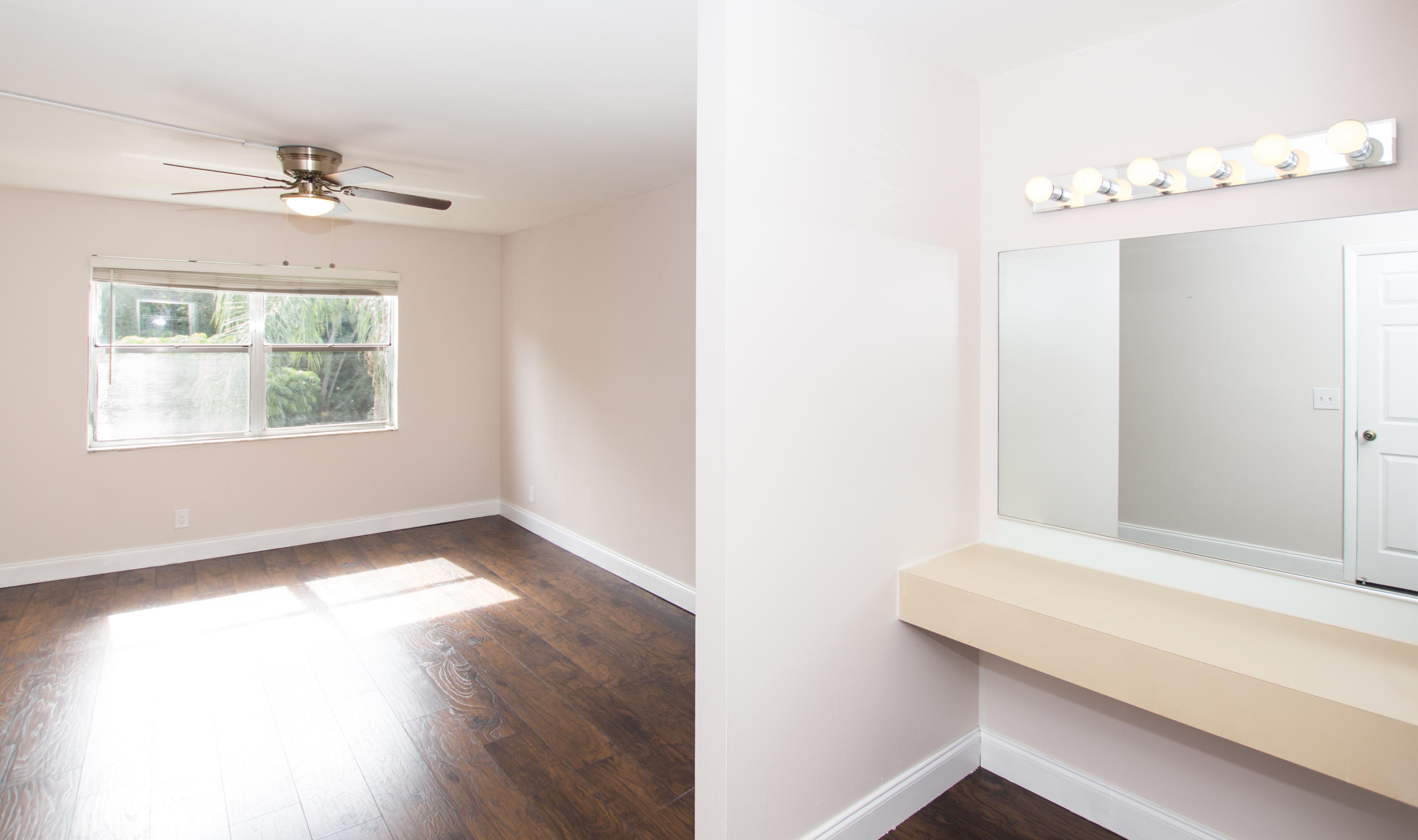 7080 Nova Drive, Unit 306B Davie, FL 33317 - Photo 14 of 25 a view of an empty room with wooden floor and a window
