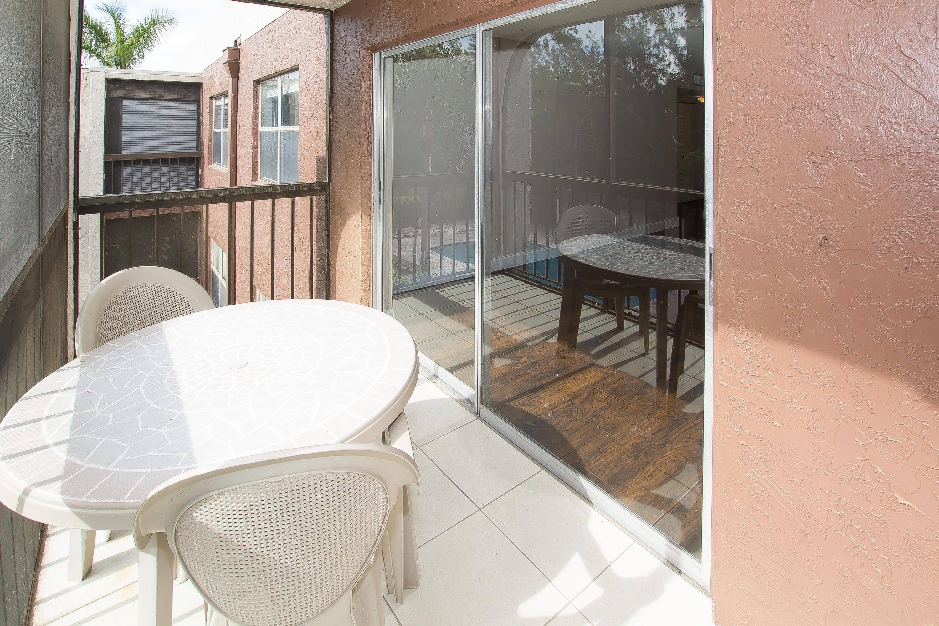 7080 Nova Drive, Unit 306B Davie, FL 33317 - Photo 25 of 25 a balcony with table and chairs