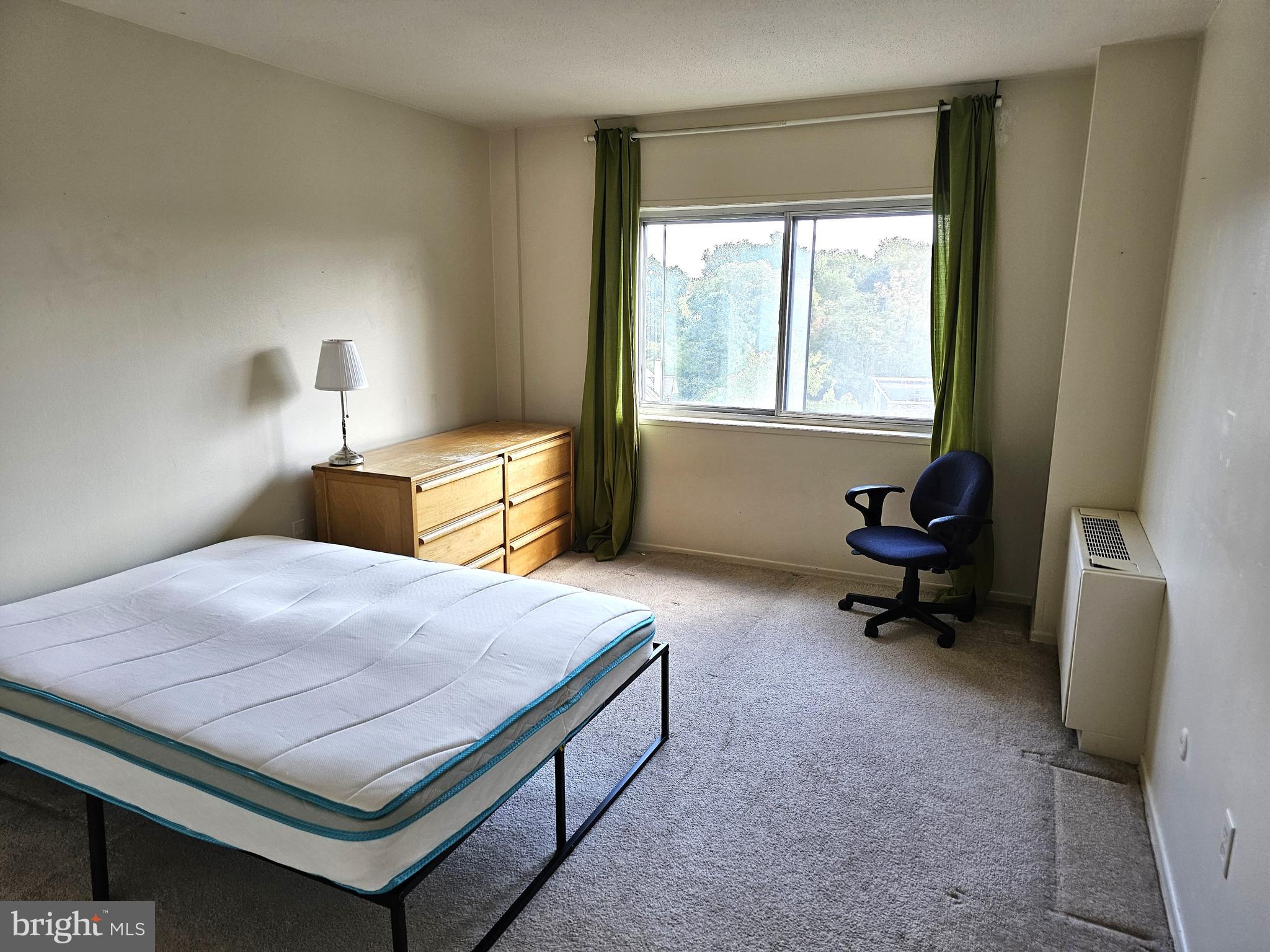 100 West Avenue, Unit 407S Jenkintown, PA 19046 - Photo 15 of 42 a bedroom with a bed and a window