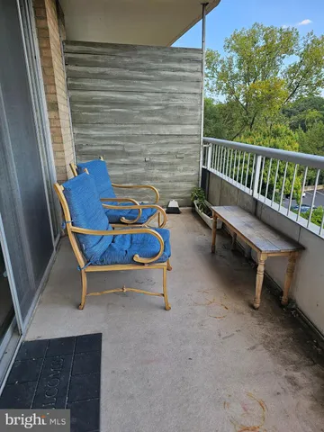 a view of a chairs in the balcony