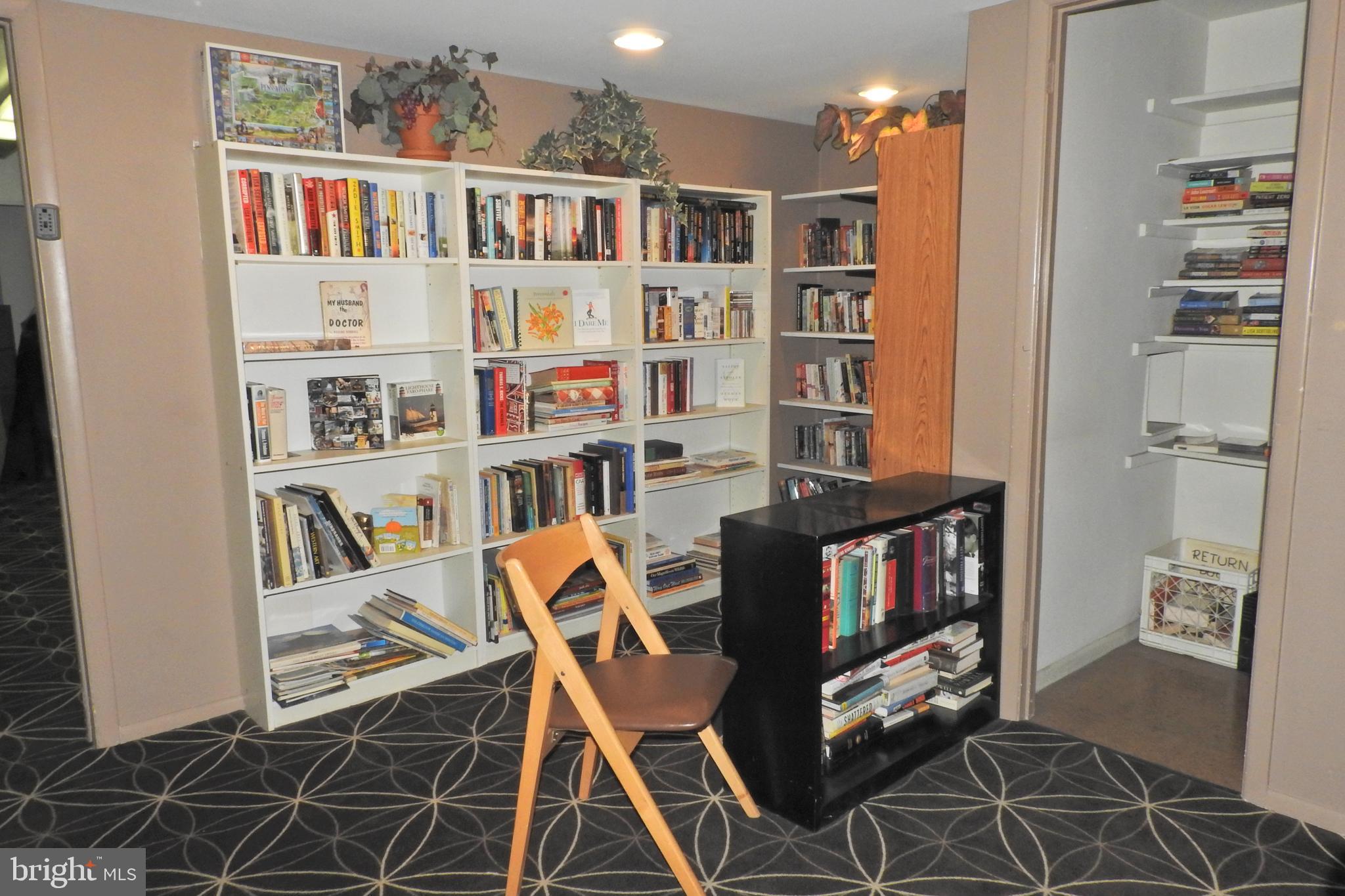 100 West Avenue, Unit 407S Jenkintown, PA 19046 - Photo 23 of 42 a work room with furniture and a book shelf