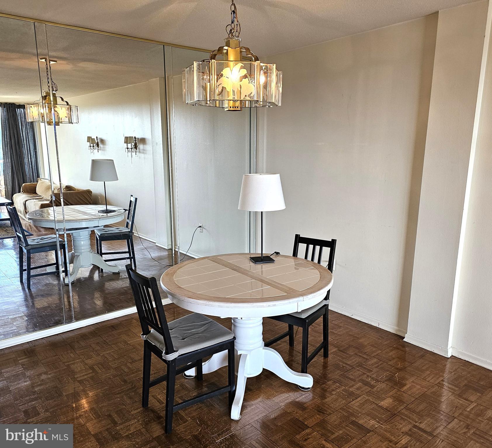 100 West Avenue, Unit 407S Jenkintown, PA 19046 - Photo 5 of 42 a dining room with furniture and chandelier