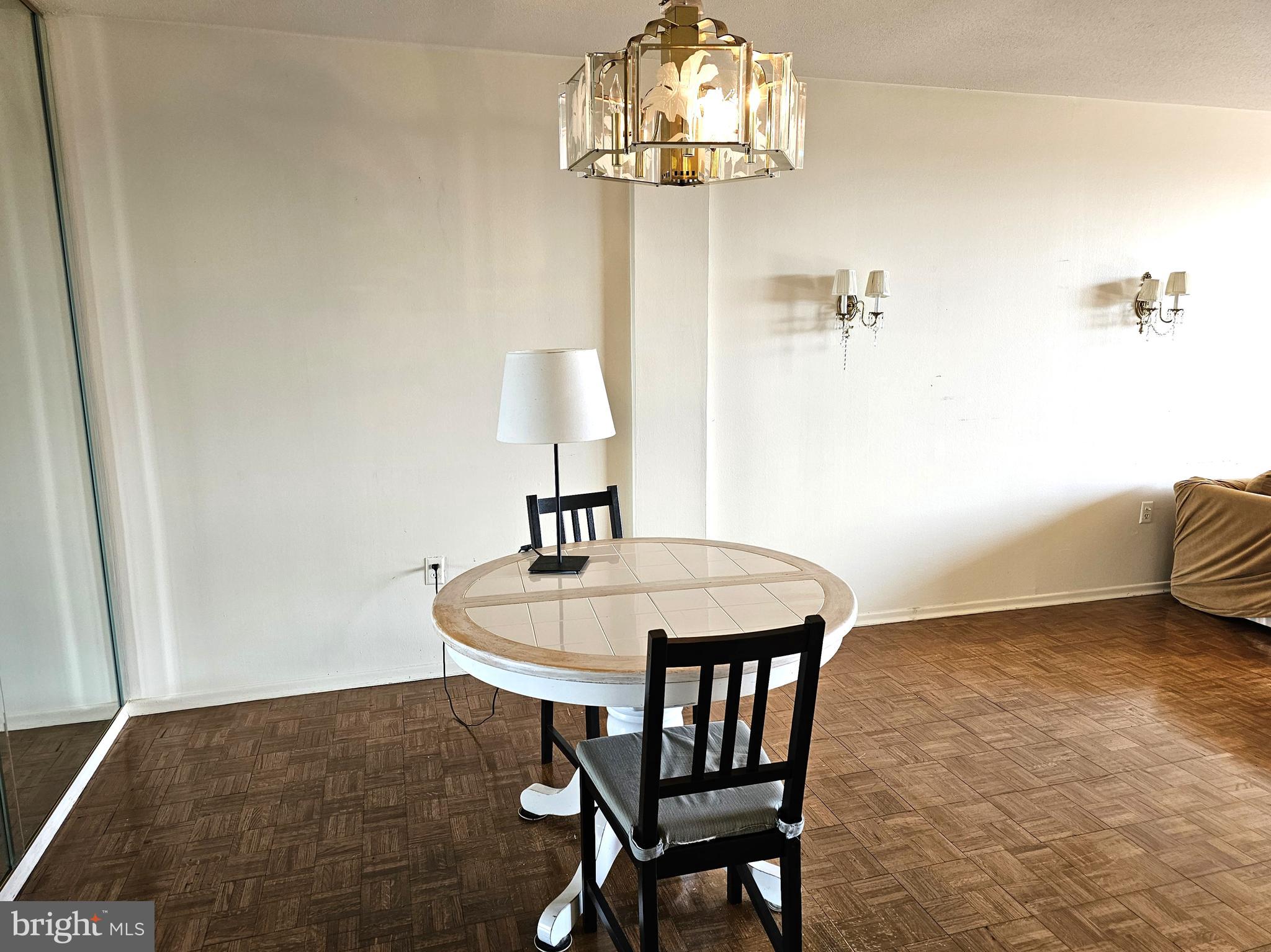 100 West Avenue, Unit 407S Jenkintown, PA 19046 - Photo 6 of 42 a dining room with furniture and chandelier
