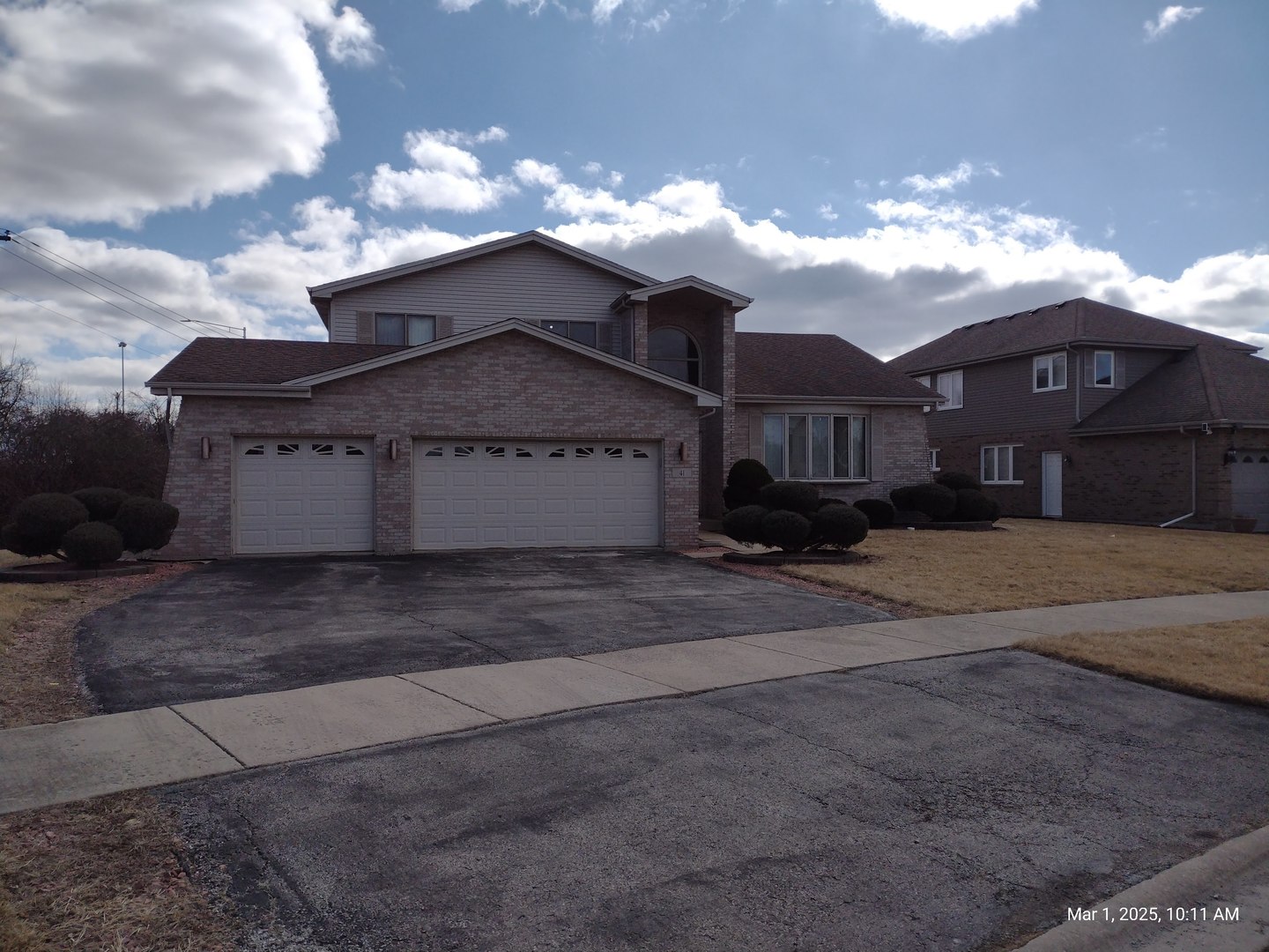 41 Manor Drive Matteson, IL 60443 - Photo 4 of 45 a front view of a house with a yard and garage