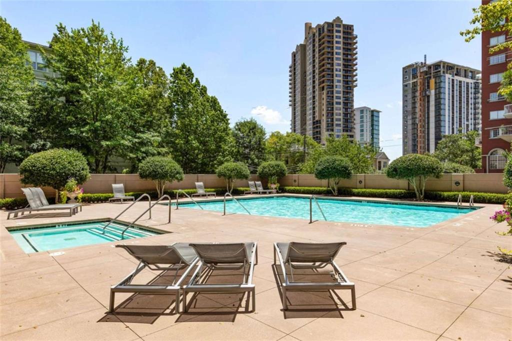 3475 Oak Valley Road Northeast, Unit 1630 Atlanta, GA 30326 - Photo 37 of 38 a view of backyard with outdoor seating ad green space