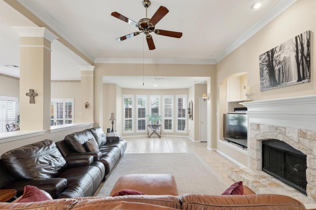 2012 Hayden Lane Corinth, TX 76210 - Photo 16 of 40 a living room with furniture fireplace and a large window