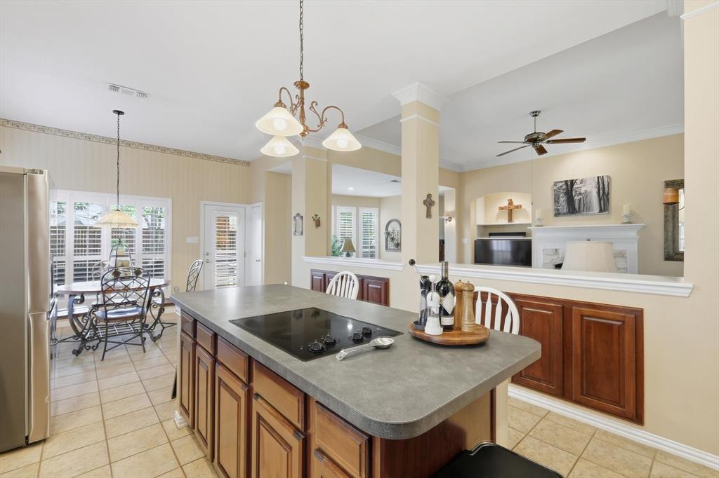 2012 Hayden Lane Corinth, TX 76210 - Photo 19 of 40 a kitchen with counter space a sink appliances and dining table