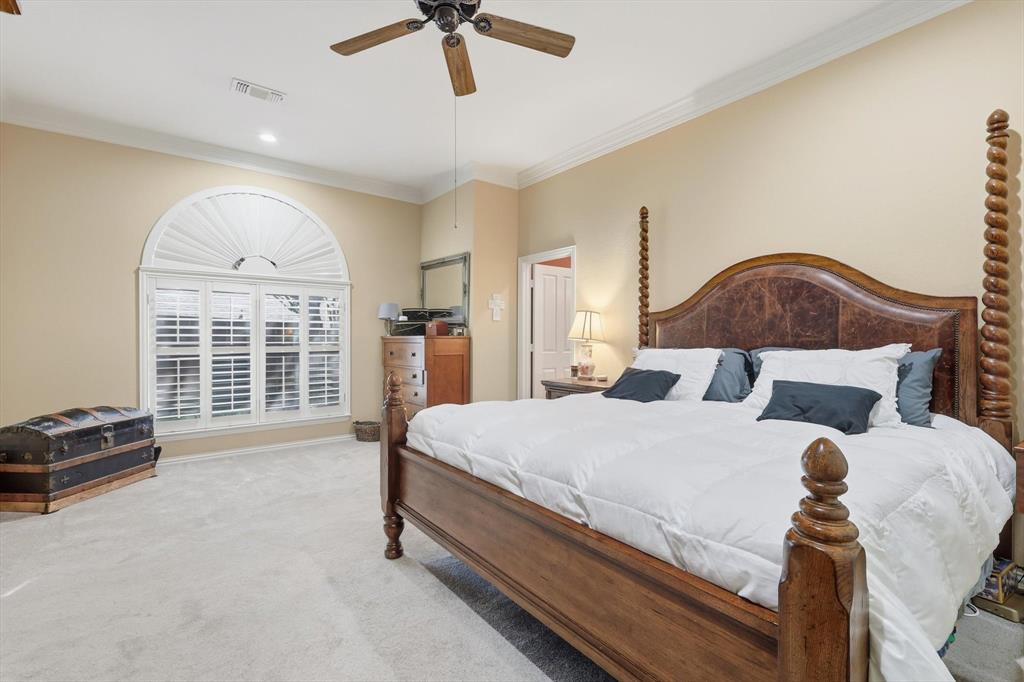 2012 Hayden Lane Corinth, TX 76210 - Photo 25 of 40 a bed room with a bed and a chair