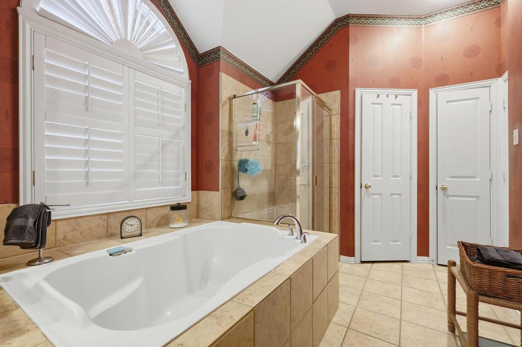 2012 Hayden Lane Corinth, TX 76210 - Photo 27 of 40 a bathroom with a bathtub and a sink